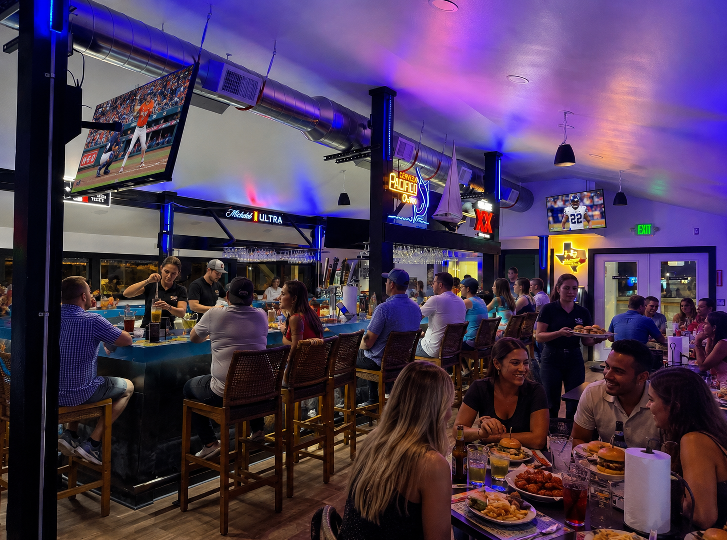 Lively Sammy G's sports bar with neon lights and guests
